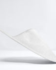 Badslipper gesloten teen wit - Verpakt in papieren band (Doos van 100 stuks)